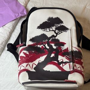 Sprayground White and Red Backpack with Tree Design used but good condition